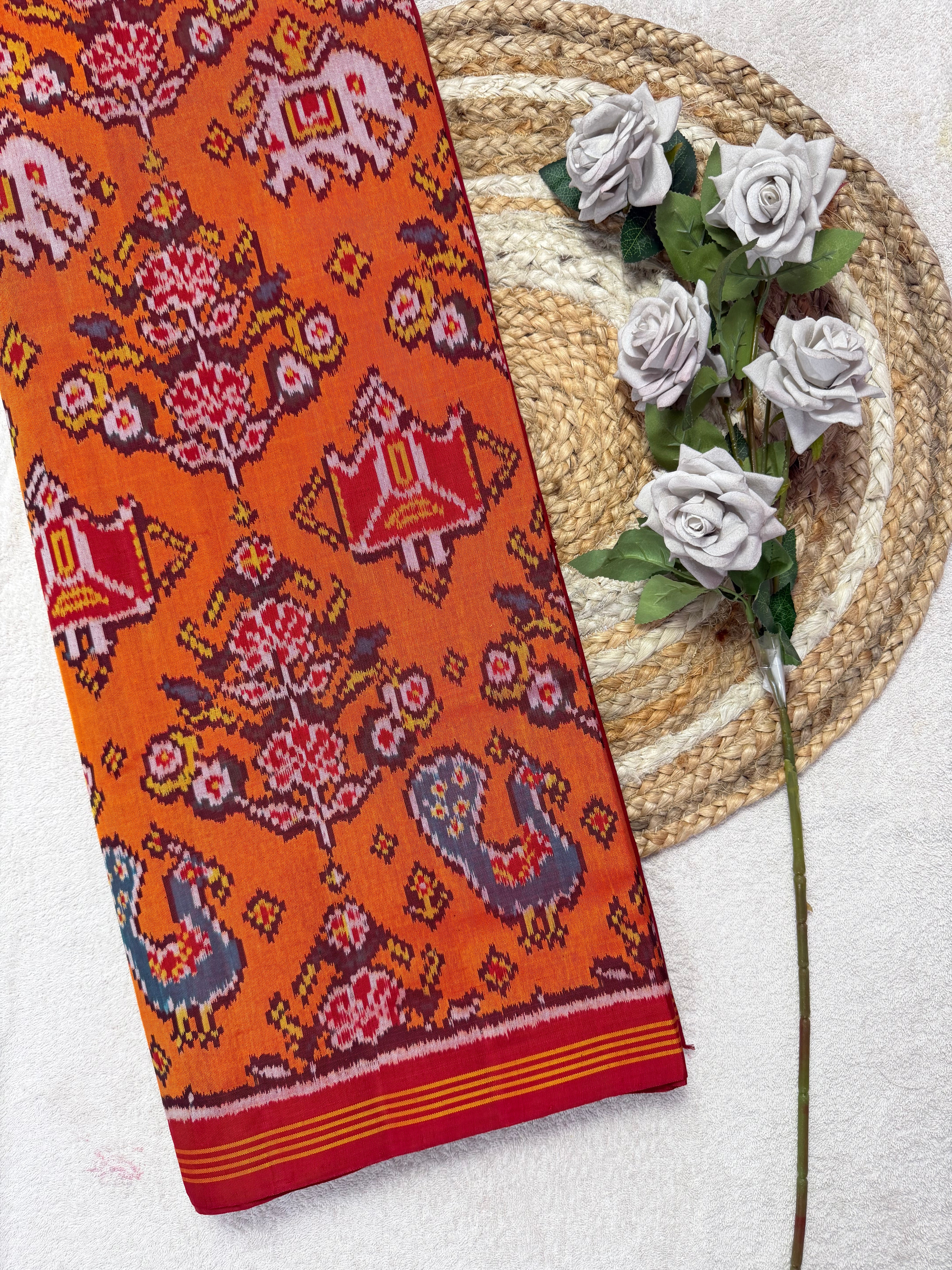Orange with Motifs Design Handwoven Patola Silk Saree Main image