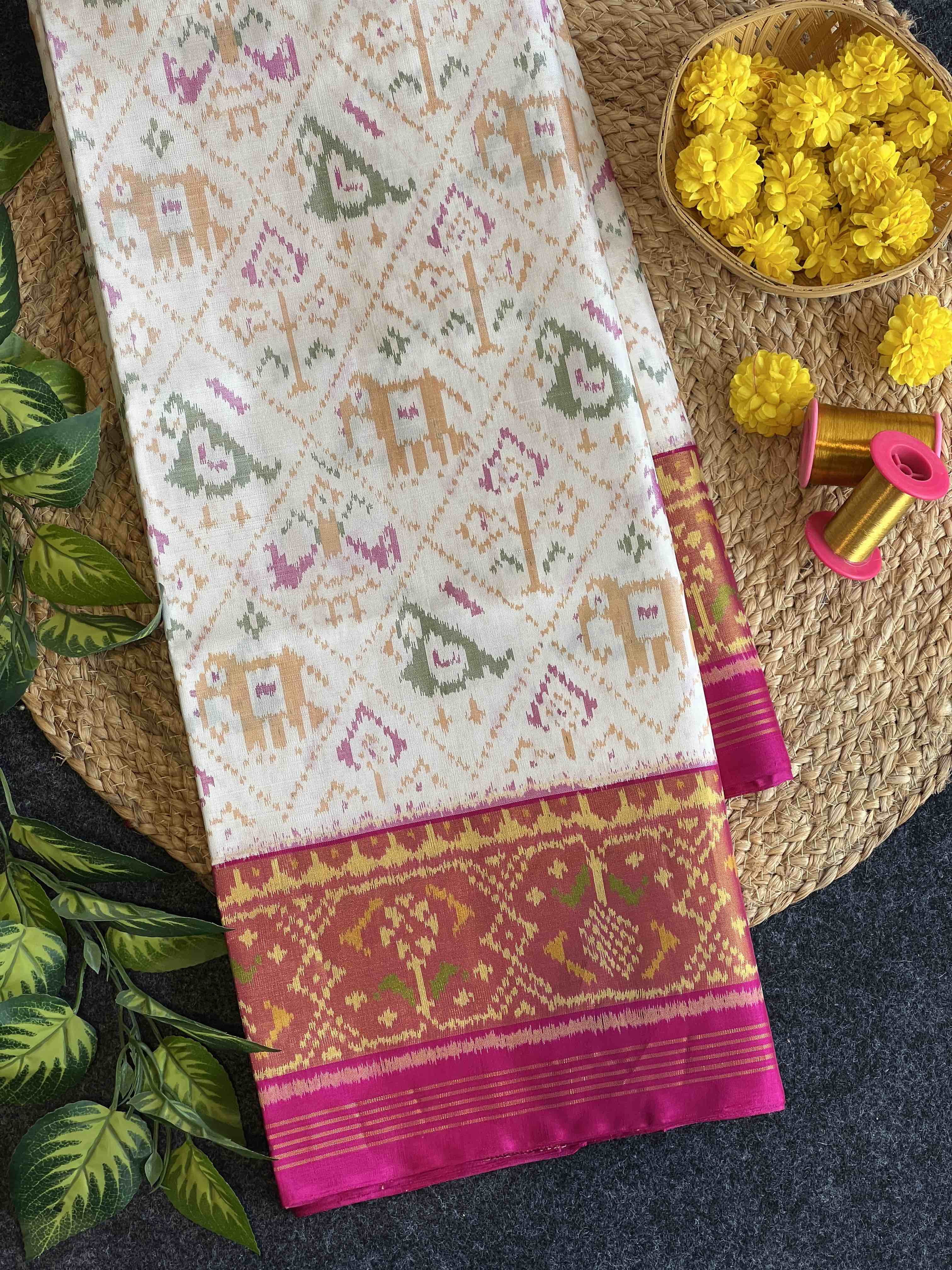 White Narikunj with Pink Pallu Traditional Design Handwoven Patola Silk Saree Main image
